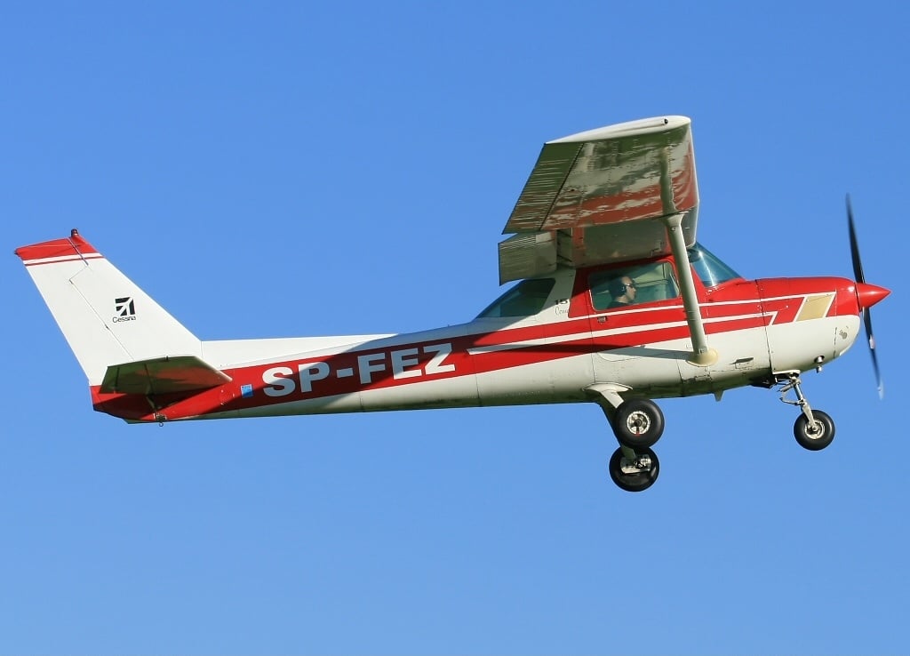Cessna 150 on a grass strip, three-quarter view