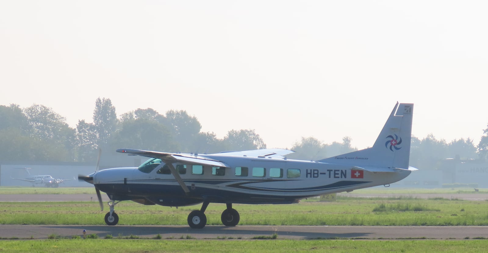 Cessna 208B Grand Caravan EX in flight, profile view